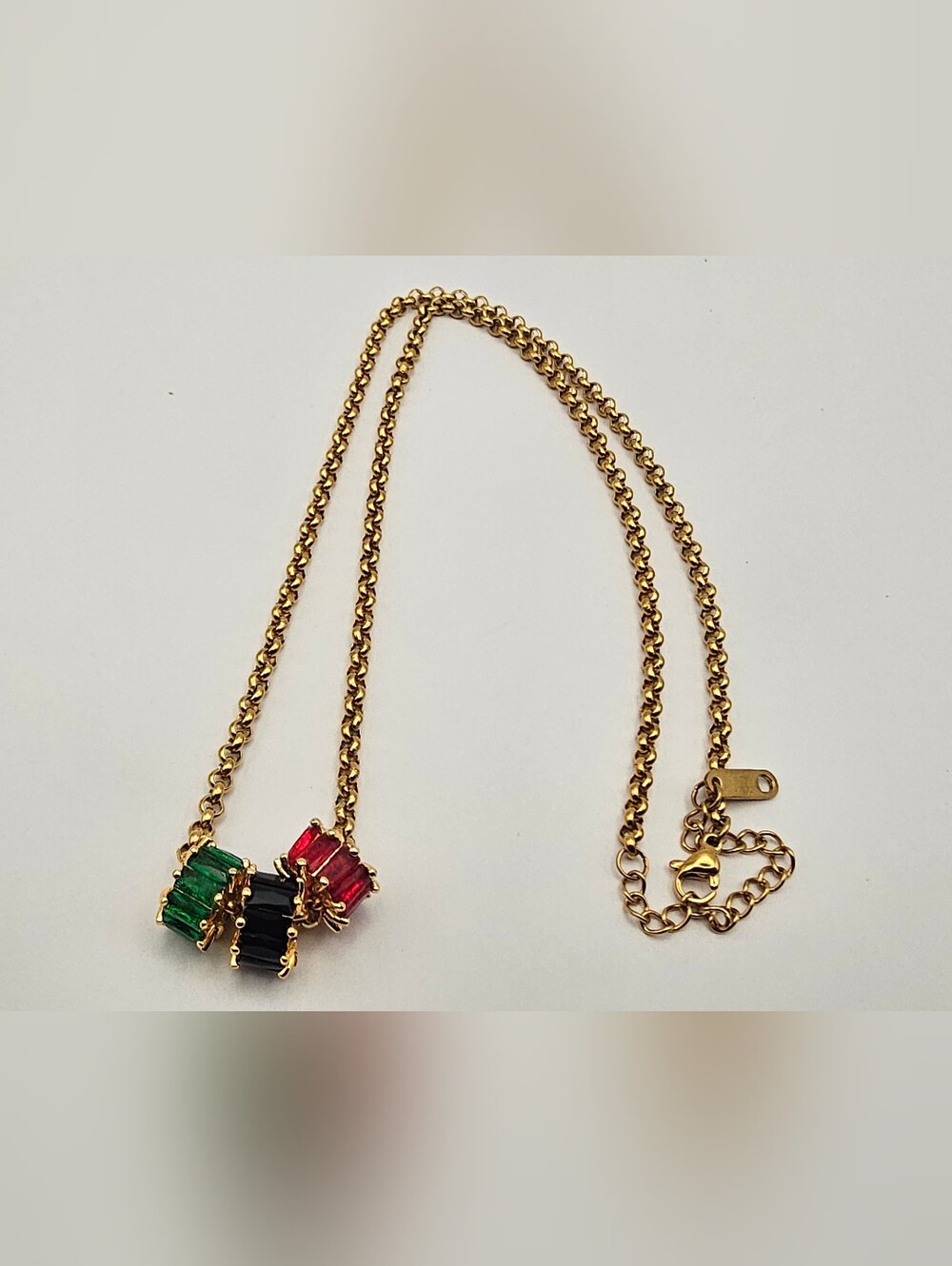 Gold Chain Necklace with Green, Black & Red Gem Pendants